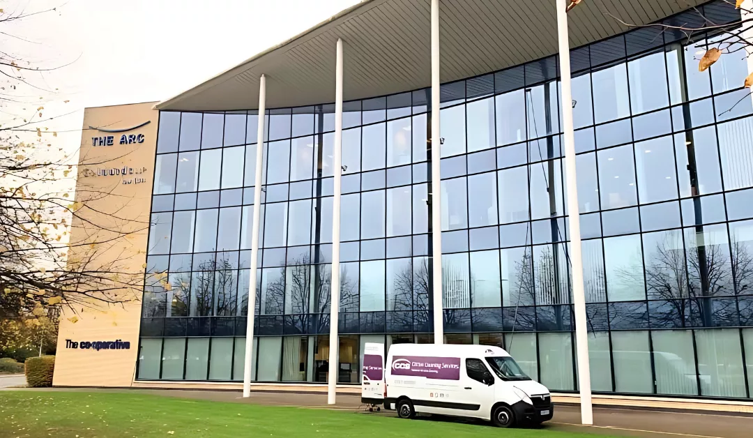 Clifton window cleaning van and employee cleaning windows.