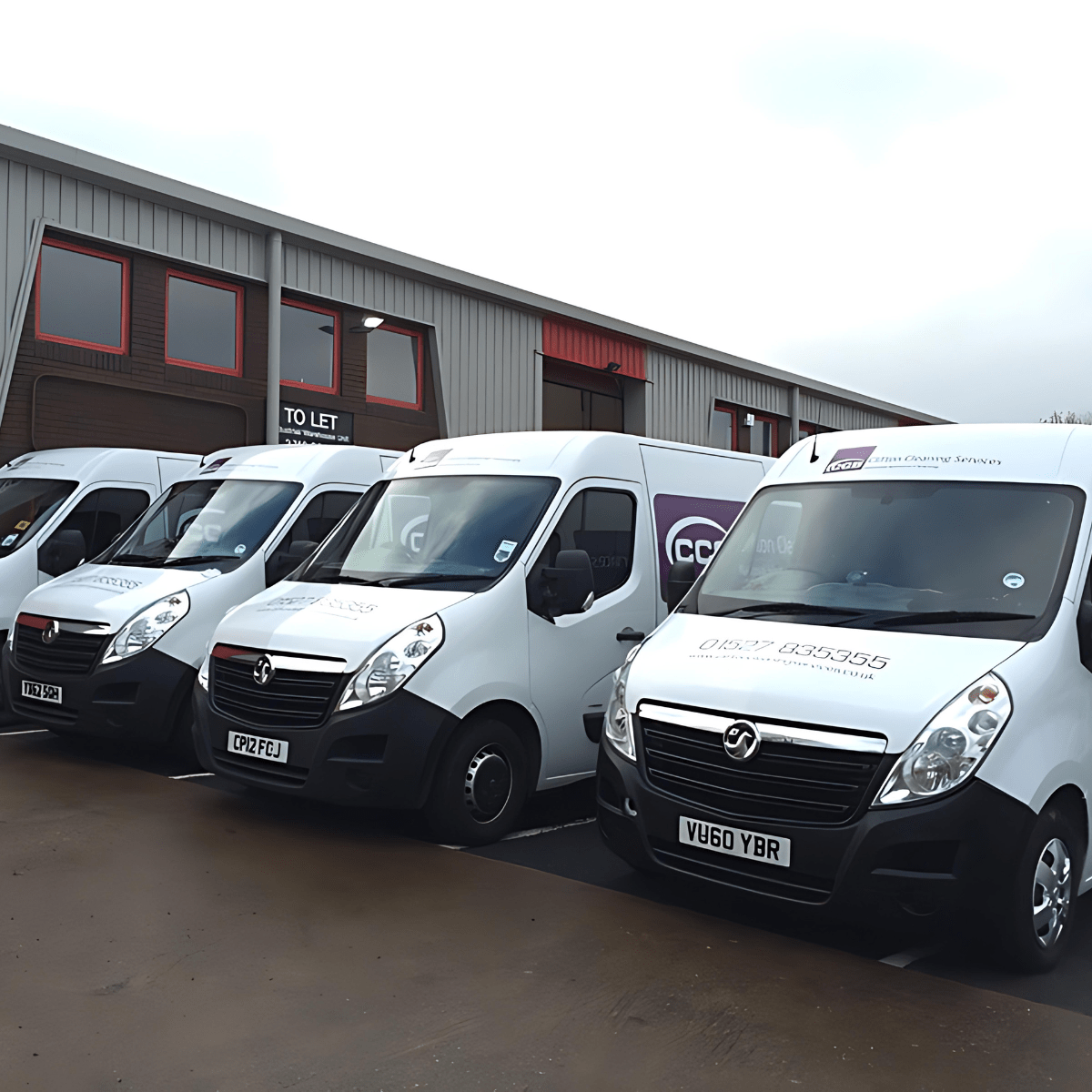 Clifton Commercial Cleaning vans parked in the car park.